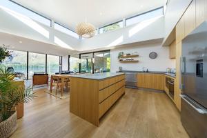 a kitchen with a large island with a counter top at Marina Terrace, Wanaka in Wanaka