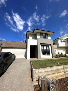 a house with a car parked in front of it at Coastal Oasis - 10 mins to Torquay, 10 mins to Geelong ! in Mount Duneed