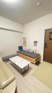 Una cama o camas en una habitación de Ocean 海上玩家 景觀溫泉小館
