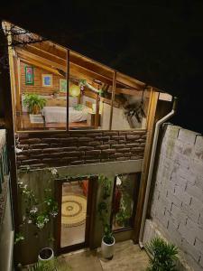 a model of a house with plants in it at Casa del árbol - Mitad del mundo in Quito