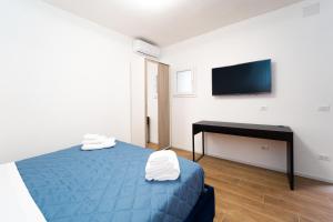 Llit o llits en una habitació de Procida - Roots Partenopee