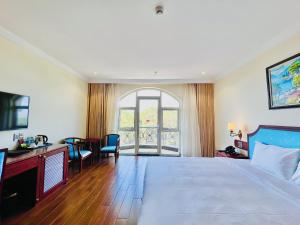 Postel nebo postele na pokoji v ubytování CALYSSA HOTELS & VILLAGE