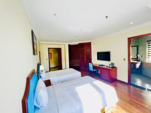 TV a/nebo společenská místnost v ubytování CALYSSA HOTELS & VILLAGE