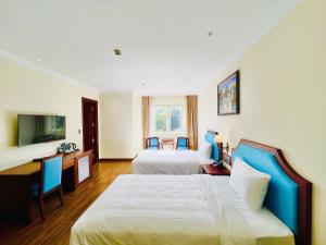 TV a/nebo společenská místnost v ubytování CALYSSA HOTELS & VILLAGE