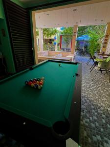 a pool table with balls on top of it at Casa Fausto’s in Azcorra