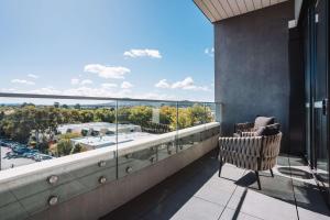 a balcony with a view of a parking lot at Perfect Located 1-Bed with Great Views & Parking in Kingston 