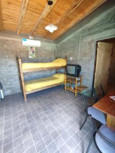a room with two bunk beds and a tv at Ranchouse in San Rafael