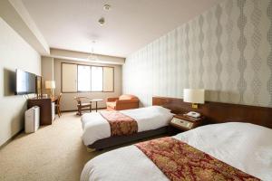 Giường trong phòng chung tại Hotel Asyl Nara