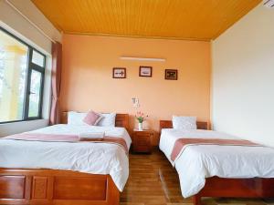 Giường trong phòng chung tại Sunny Trang An homestay