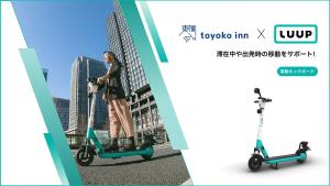 a woman riding an electric scooter on a street at Toyoko Inn Osaka Namba Nippombashi in Osaka