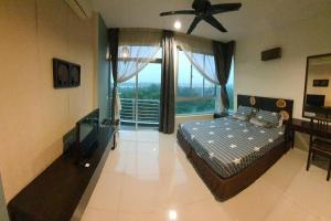 a bedroom with a bed and a ceiling fan at Sky Residence -3 Bedrooms Condo at Cinta Sayang, Sungai Petani in Sungai Petani
