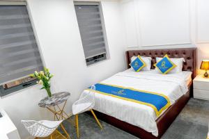 Postel nebo postele na pokoji v ubytování ROSA QUEEN HOTEL