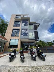 three motorcycles parked in front of a building at Eight Breeze in Baclayon