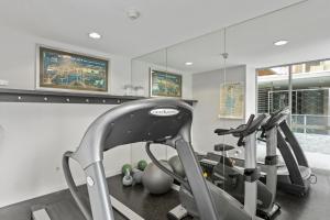 a gym with two exercise bikes in a room at Private 2-Bed Apartment & 5 minutes walk to QPAC in Brisbane