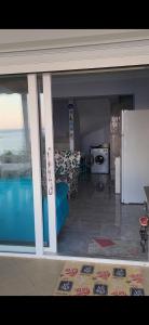 a view of a living room with a view of a kitchen at Rüyakent Sea Panorama in Didim