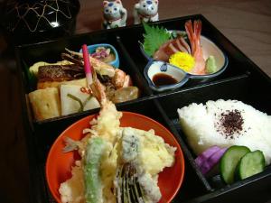 a tray of food with different types of food at Hotel Alpha-One Niigata in Niigata