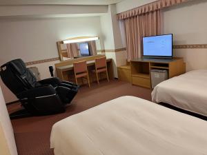 Postelja oz. postelje v sobi nastanitve Hotel Alpha-One Niigata