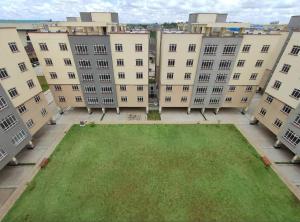 an aerial view of an apartment building with a green lawn at Luxury Homes in Nairobi in Athi River