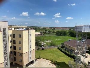 an aerial view of a building and a field at Luxury Homes in Nairobi in Athi River