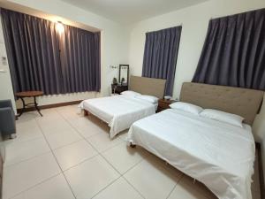Una cama o camas en una habitación de Yan Gui Lai B&B