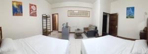 Una cama o camas en una habitación de Yan Gui Lai B&B