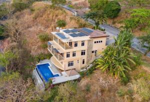 an aerial view of a house with solar panels on it at Casa Monk in Nasugbu