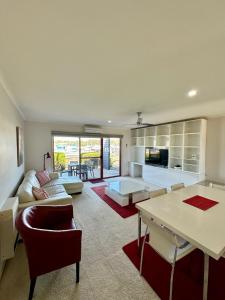 a living room with a couch and a table at Mariners Cove at Paynesville in Paynesville