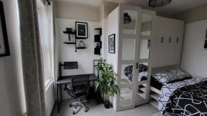 a bedroom with a bed and a desk in it at Luxury House Room to Rent in a 4-Bed House with Parking Short Lets  in Liverpool