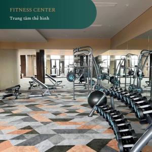 a gym with several treadmills and machines at APEC MANDALA KOLYA Building D in Phan Thiet