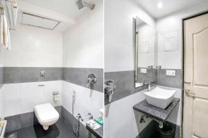 a bathroom with a sink and a toilet at FabHotel Anam International in Mumbai