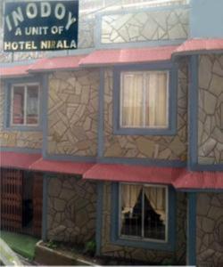 a model of a hotel with a building at HOTEL NIRALA , Darjeeling in Darjeeling