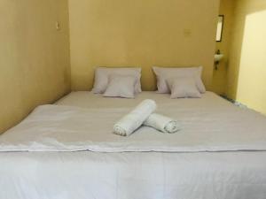 Llit o llits en una habitació de Kampung homestay