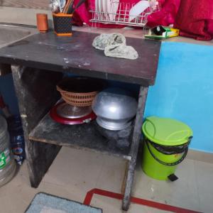 a table with a bowl and a pot on it at Piyari Home stay 2 in Kolkata