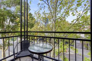 a table and two chairs on a balcony at 2BDR 1BTH - James Street Magic in Perth