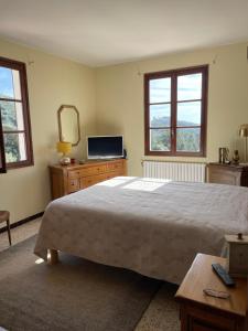 Villa de la Plage tesisinde bir odada yatak veya yataklar