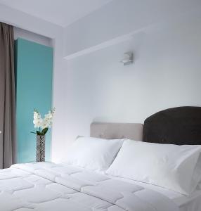 Postel nebo postele na pokoji v ubytování Coral Hotel