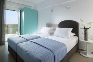 Postel nebo postele na pokoji v ubytování Coral Hotel