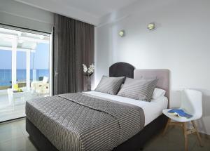 Postel nebo postele na pokoji v ubytování Coral Hotel