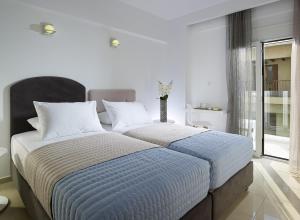 Postel nebo postele na pokoji v ubytování Coral Hotel