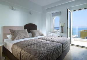Postel nebo postele na pokoji v ubytování Coral Hotel