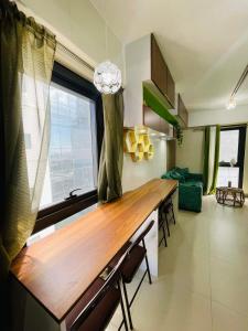 a kitchen with a wooden counter top in a room at Studio 7 in Manila
