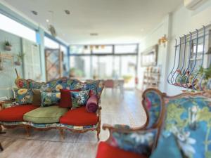 a living room with a couch and two chairs at La Jabotte in Antibes