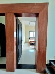 an open door into a room with a bedroom at CityAir in Pune