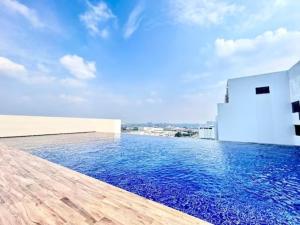 a swimming pool on the roof of a house at Jeff & Ricky Homestay102@ The Podium in Maong Bazaar
