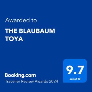 a blue sign with the text awarded to the bluburn toyota at THE BLAUBAUM TOYA in Lake Toya