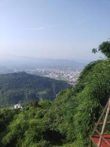 a view of a city from the top of a hill at Hotel Royal Stay , Katra in Katra