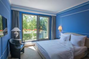 Ένα ή περισσότερα κρεβάτια σε δωμάτιο στο Hotel Parc Belair