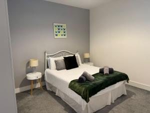 a bedroom with a bed with two pillows on it at Harbourside Apartment - 1 Bed Apartment in Whitehaven