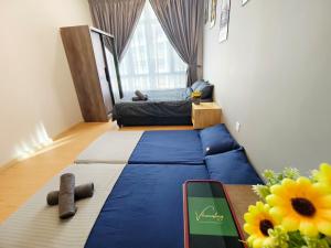 a small room with a bed and a large window at Kuantan- Cozy Little Home @Mahkota Valley By VHOME in Kuantan +19 photos