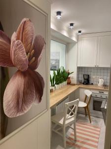 a kitchen with a door with a flower on it at Best apartments on Lyatoshinsky street in Zhytomyr